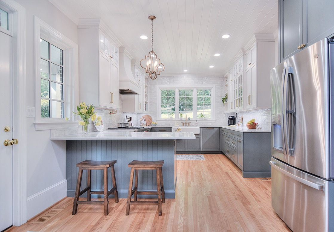 Transformed Meadowbrook kitchen with new cabinetry, lighting and laundry area