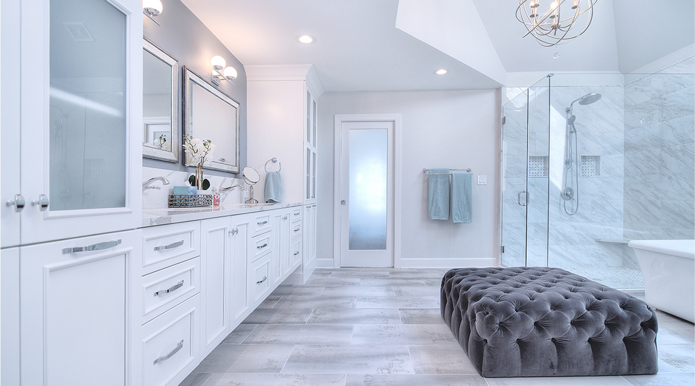 Serene primary bathroom with generous circulation and considered storage
